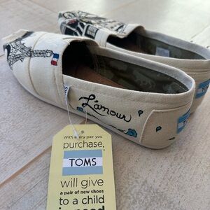 Toms Cream Canvas Slip-Ons with Eiffel Tower Design